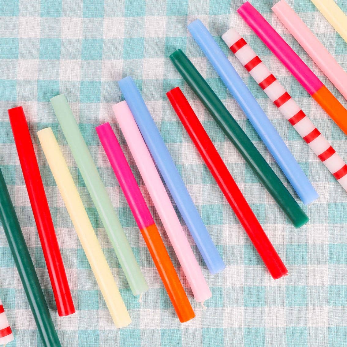 Single Red and White Striped Taper Candle