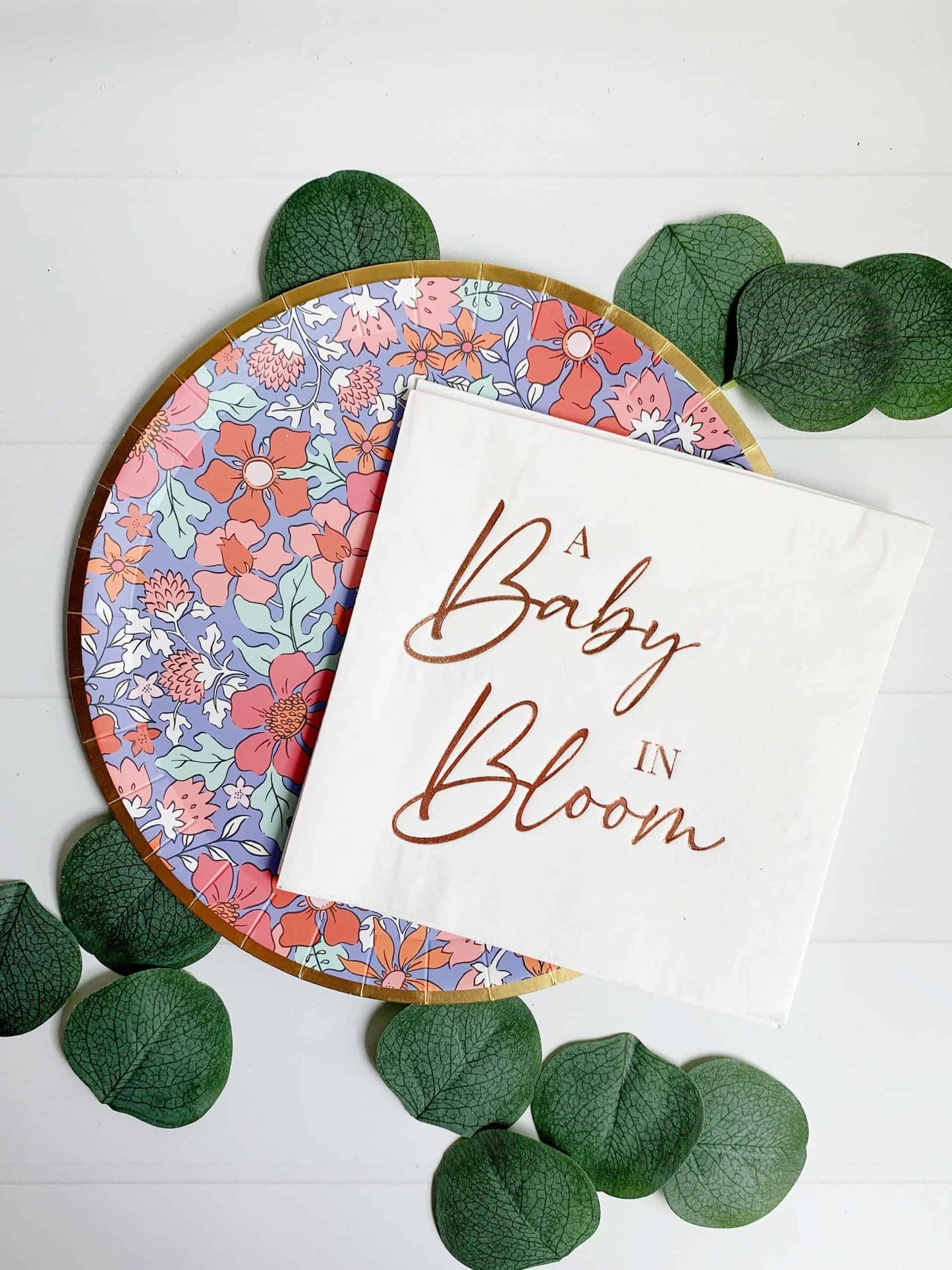 A Baby in Bloom baby shower napkins - rose gold foil on white luncheon sized napkins for a baby girl shower