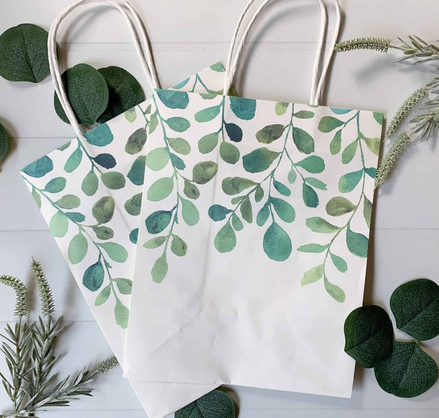 These sage and emerald watercolor eucalyptus greenery paper gift bags are perfect for wrapping favors and gifts. Perfect for a safari baby shower, bridal shower, wedding welcome or other use.