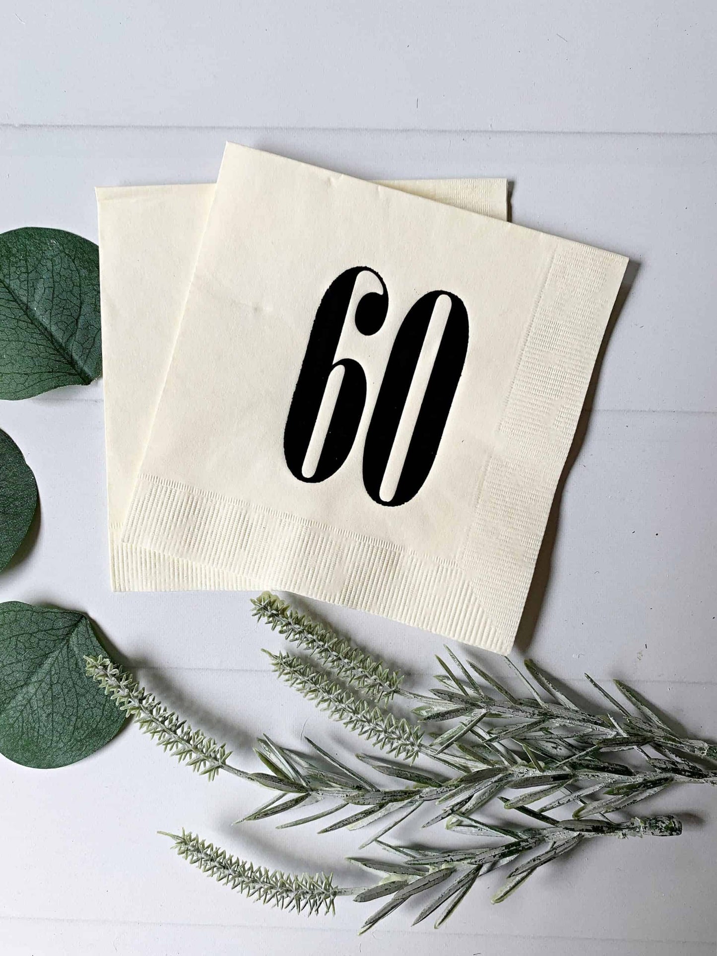 Add a touch of retro charm to your birthday or anniversary celebration with our black on ivory 60 napkins. These high-quality paper napkins feature a bold and stylish '60' design, perfect for a milestone celebration. With their classic black and ivory color scheme, these napkins will complement any party theme or decor. Order now and bring a touch of vintage flair to your special occasion!