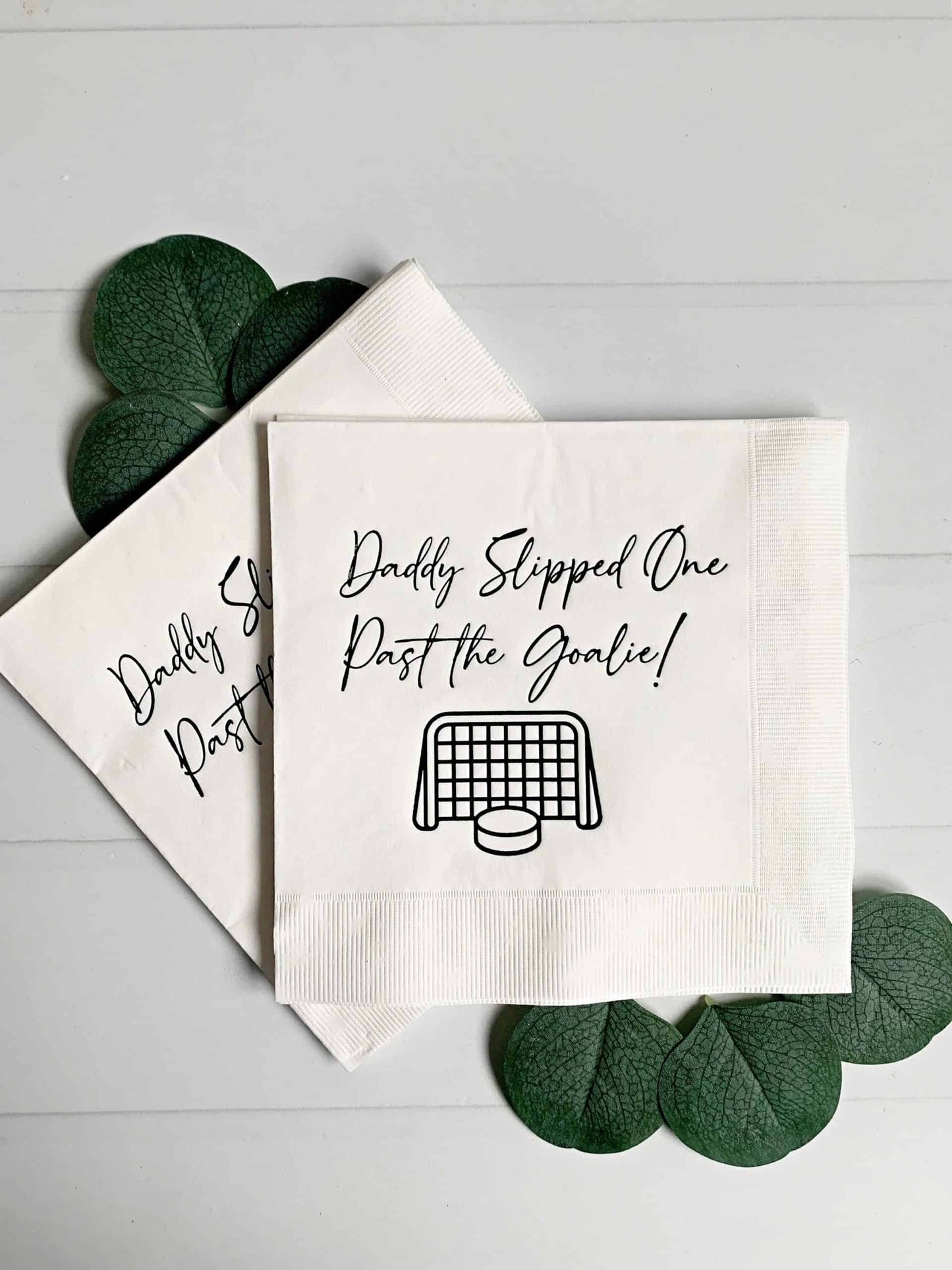 Celebrate the arrival of your little one with a playful twist with our "Daddy Slipped One Past the Goalie" Gender Reveal Hockey themed napkins. These stylish napkins feature a fun hockey-themed design and a humorous message, making them the perfect choice for a gender reveal party or other special occasion. Whether you're serving cake, appetizers, or beverages, these napkins are both functional and playful, adding a special touch to your celebration. So, get ready to celebrate your little goal scorer with o