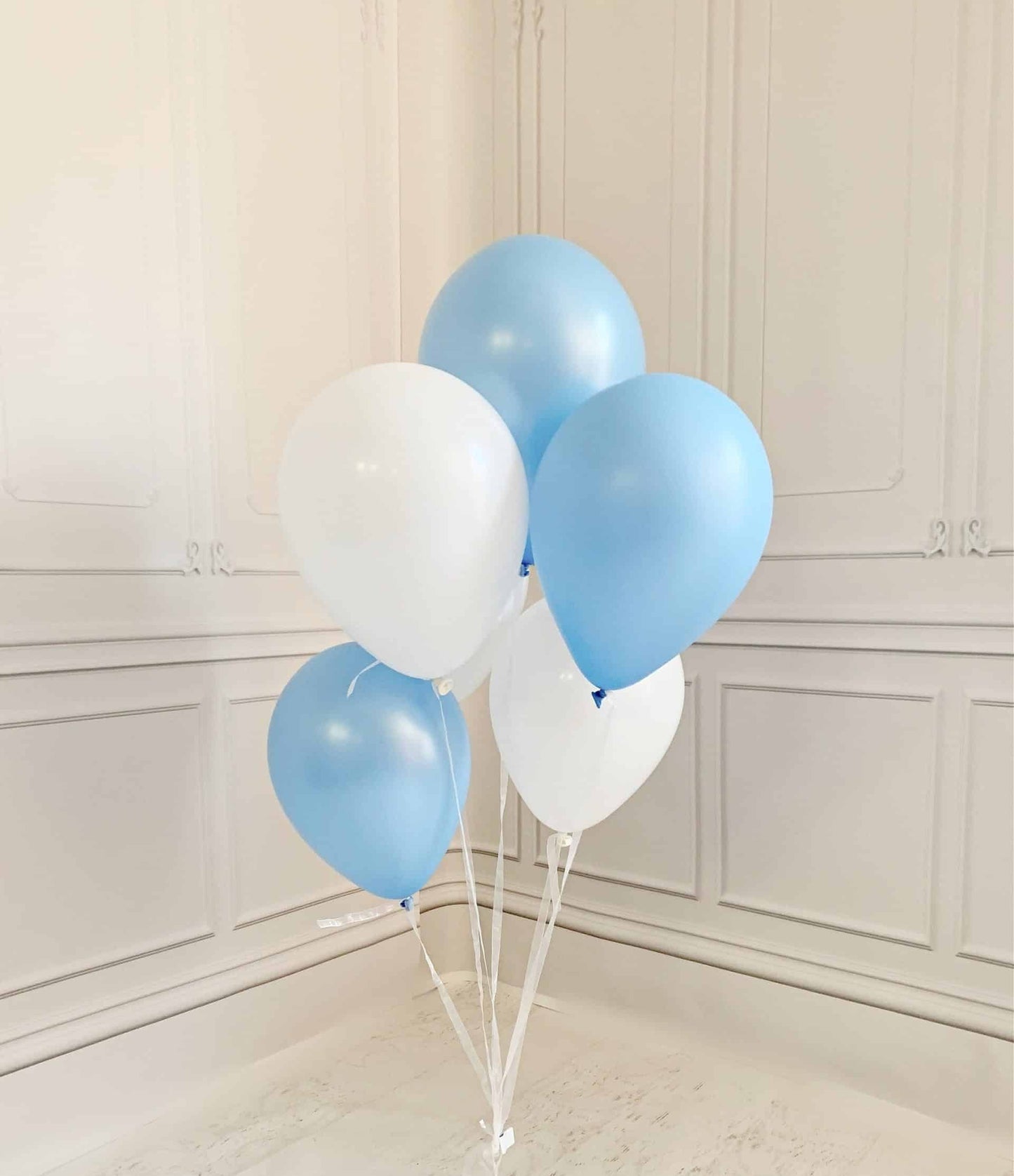 Celebrate your special event in style with our Baby Blue and White Balloon Bouquet! This set of 6 balloons is perfect for a baby shower, airplane party, or bridal shower.