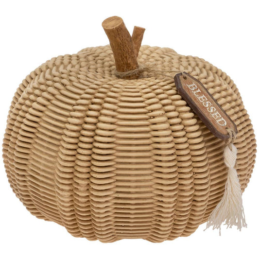 Woven pumpkin decoration with a 'blessed' tag on a white background
