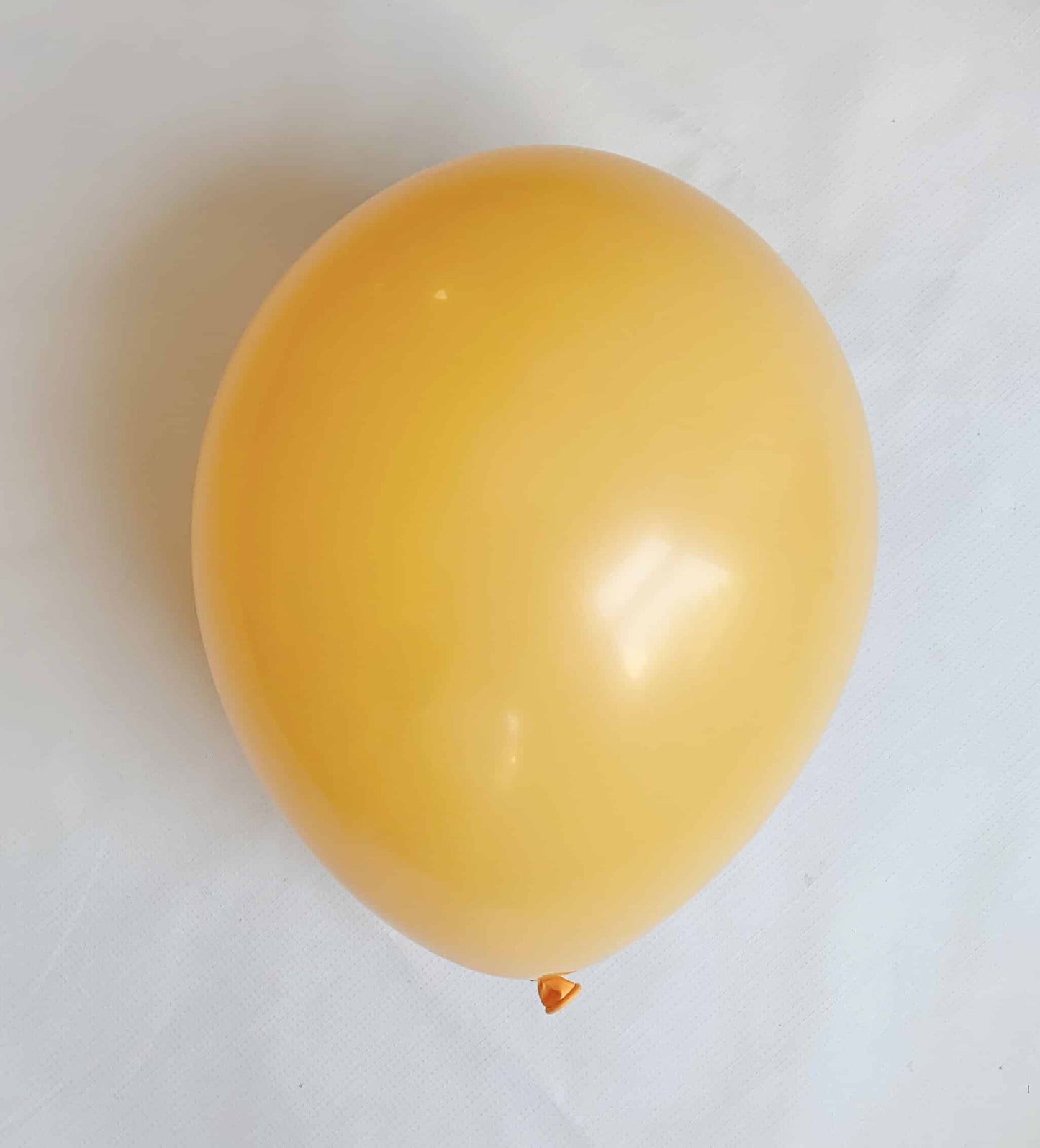 Yellow balloon on a white background