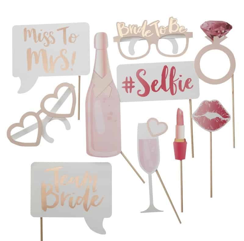 Rose gold and blush photo props for a bachelorette party