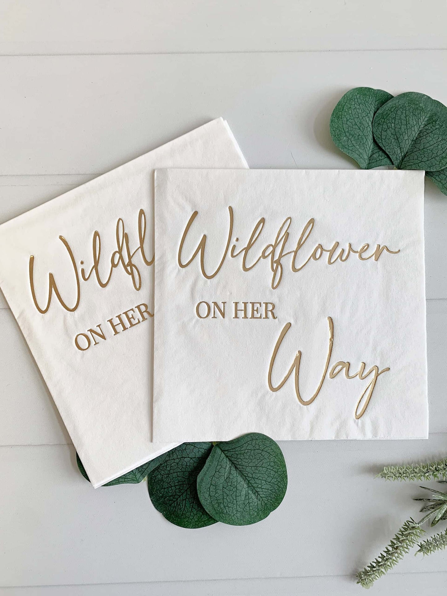 Add a touch of elegance to your next luncheon with EnFete's "Wildflower On Her Way" Luncheon Napkins in dazzling gold. These luxurious napkins feature a delicate wildflower pattern that exudes charm and sophistication.