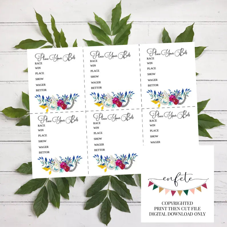 Three printed horse racing betting slips with floral designs on a white wooden surface with green leaves.