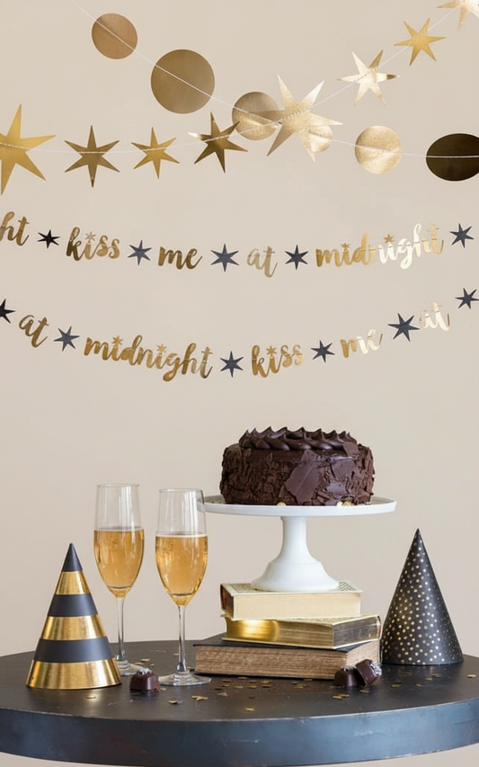 Kiss Me at Midnight banner with soft cream background