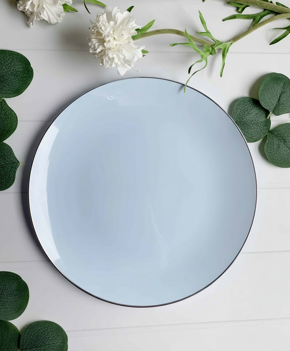 Overhead flat lay of ice blue plates