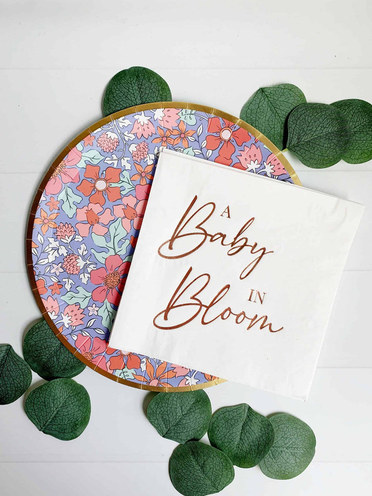 A Baby in Bloom baby shower napkins - rose gold foil on white luncheon sized napkins for a baby girl shower