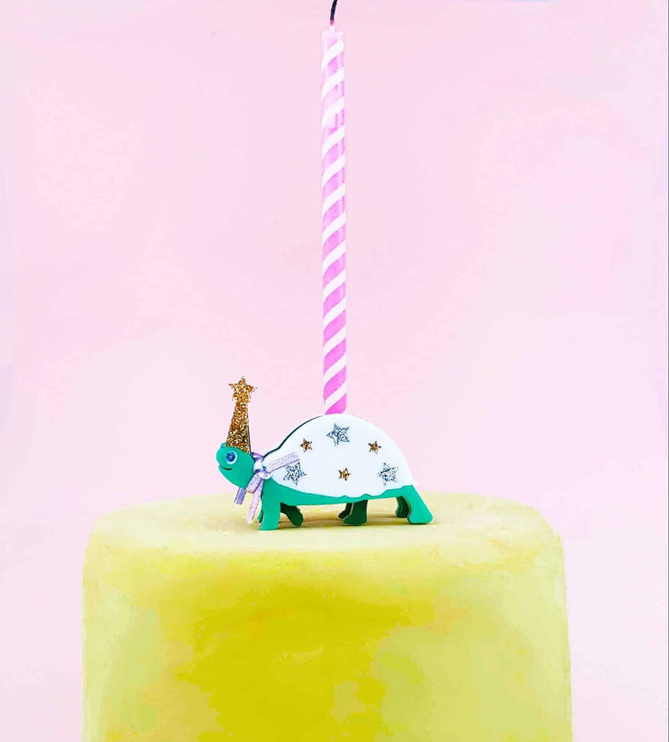 But we don't stop at just candles - we also offer a variety of candle holders and accessories to make your celebration even more special. Our animal-shaped candle holders are perfect for a jungle-themed party, while our elegant rose gold candle holders ar