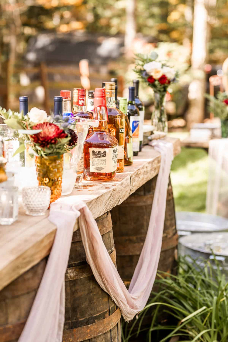 Wedding Cloth Napkins and Linen on our rustic wedding bar with wood and barrels