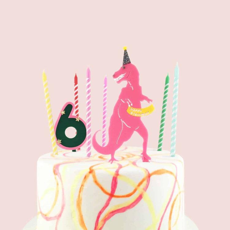Pink Dinosaur Cake Topper This fun and festive pink girl dinosaur cake topper is the perfect addition to your little girl's birthday party. Featuring a cute pink dinosaur with a party hat, this topper is sure to bring a smile to everyone's face.
