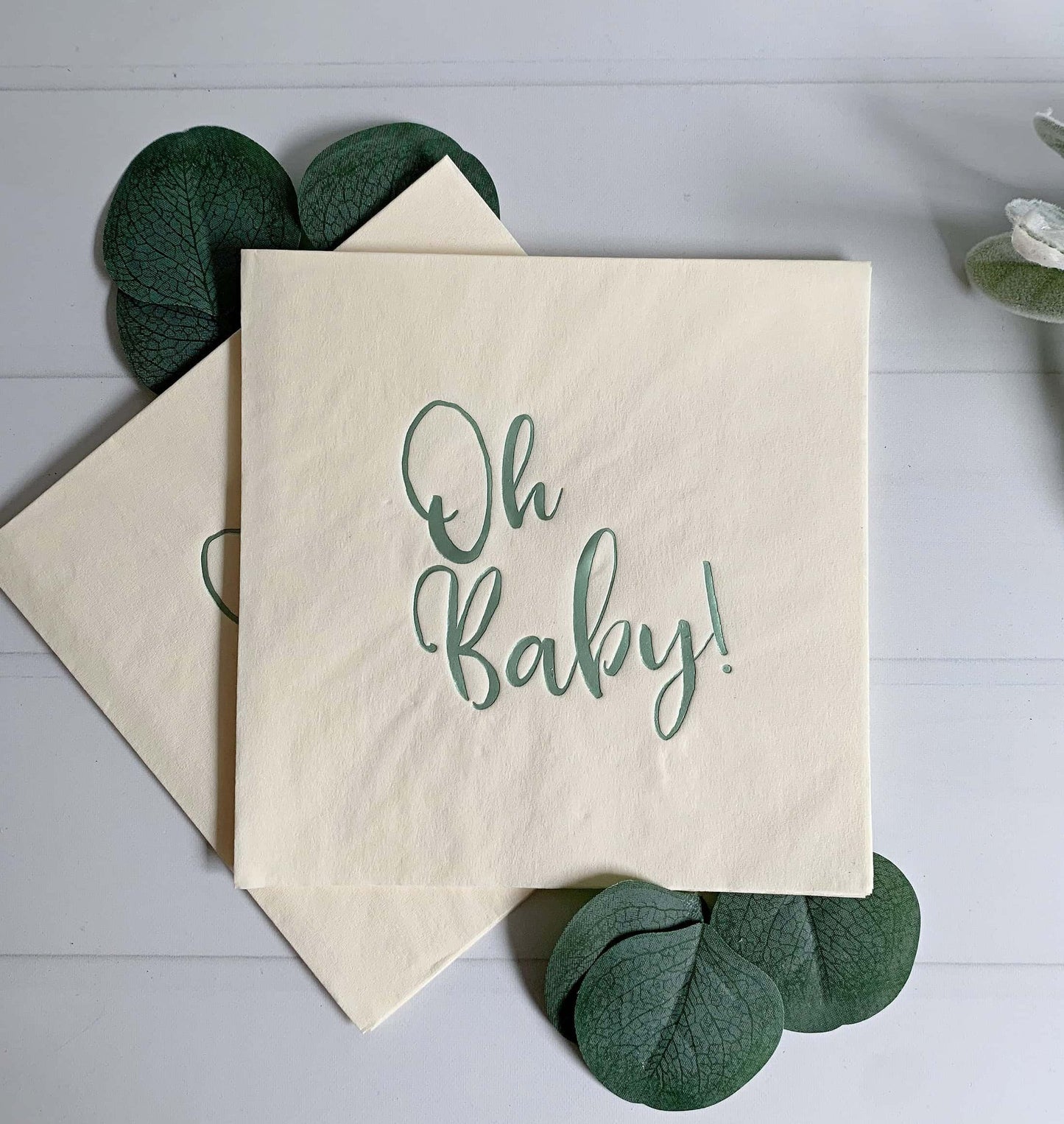 Introducing our charming "Oh Baby" luncheon napkins, adorned with a beautiful sage green foil design on a soft ecru background. These napkins are the ideal addition to any sage or greenery-themed baby shower