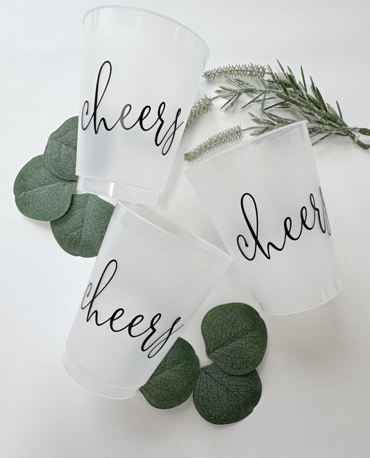 Raise a glass in style with our Frosted 16 oz "Cheers" Cups, featuring elegant black script printed on both sides. These versatile cups are perfect for celebrating birthdays, engagements, weddings, anniversaries, and all of life’s toast-worthy moments. With a sleek frosted finish and classic script