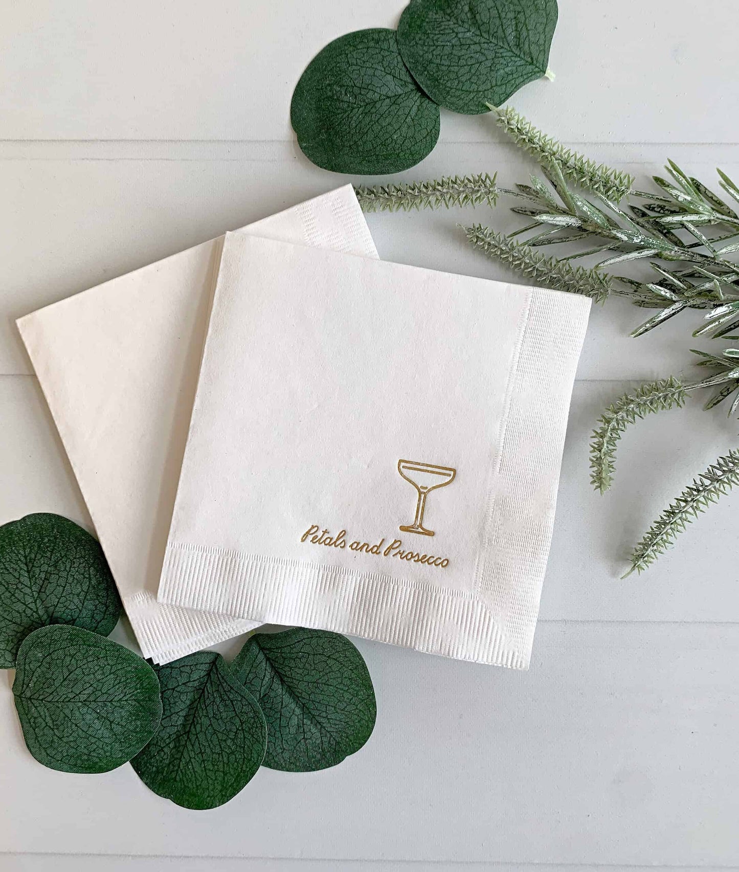 Introducing our "Petals and Prosecco" Bridal Shower and Bachelorette Cocktail Napkins, the epitome of elegance and sophistication for your pre-wedding celebrations. These exquisite napkins feature a pristine white background adorned with intricate gold foil details