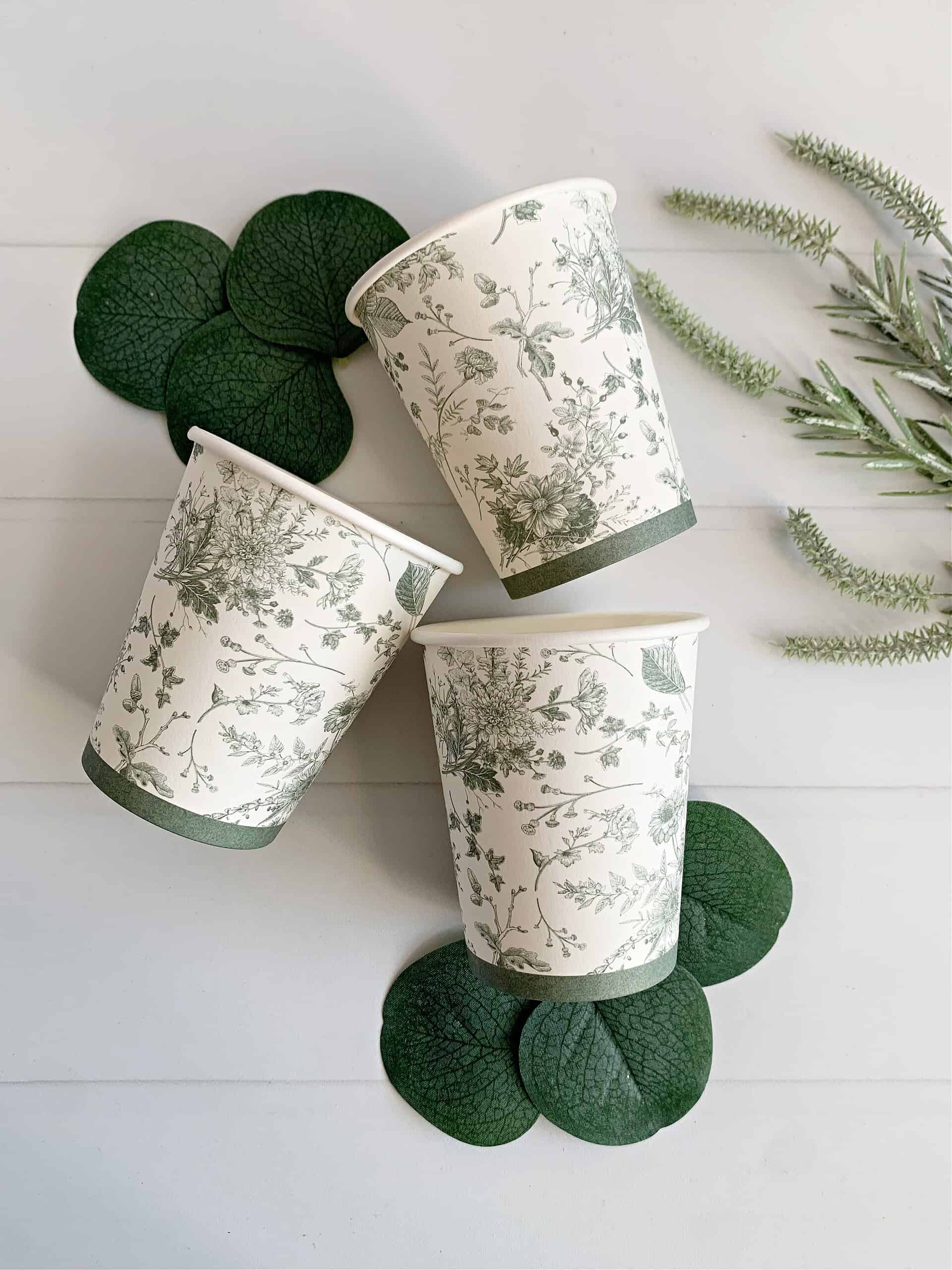 Introducing our elegant set of 8 Sage Green French Toile Paper Cups, crafted with high-quality paper. These cups are not only visually appealing but also environmentally friendly. The charming white and sage green color