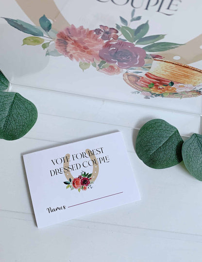 Create a fun and interactive experience at your Kentucky Derby party with EnFete's Derby "Vote for Best Dressed Couple" Voting Cards Pad. The sign, measuring 8.5 x 11 inches and printed on durable cardstock, adds a touch of elegance to your party decor while encouraging guests to participate in the festivities.