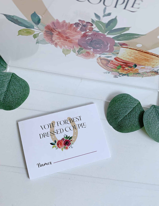 Create a fun and interactive experience at your Kentucky Derby party with EnFete's Derby "Vote for Best Dressed Couple" Voting Cards Pad. The sign, measuring 8.5 x 11 inches and printed on durable cardstock, adds a touch of elegance to your party decor while encouraging guests to participate in the festivities.