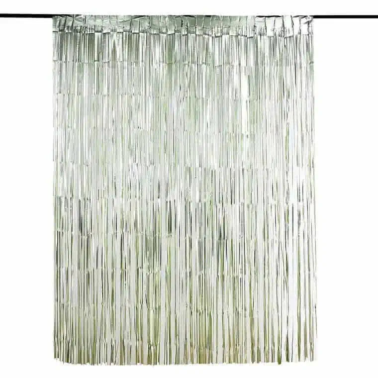 Fringe party backdrop in sage green for a baby shower or bridal shower.
