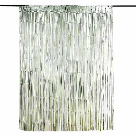 Fringe party backdrop in sage green for a baby shower or bridal shower.
