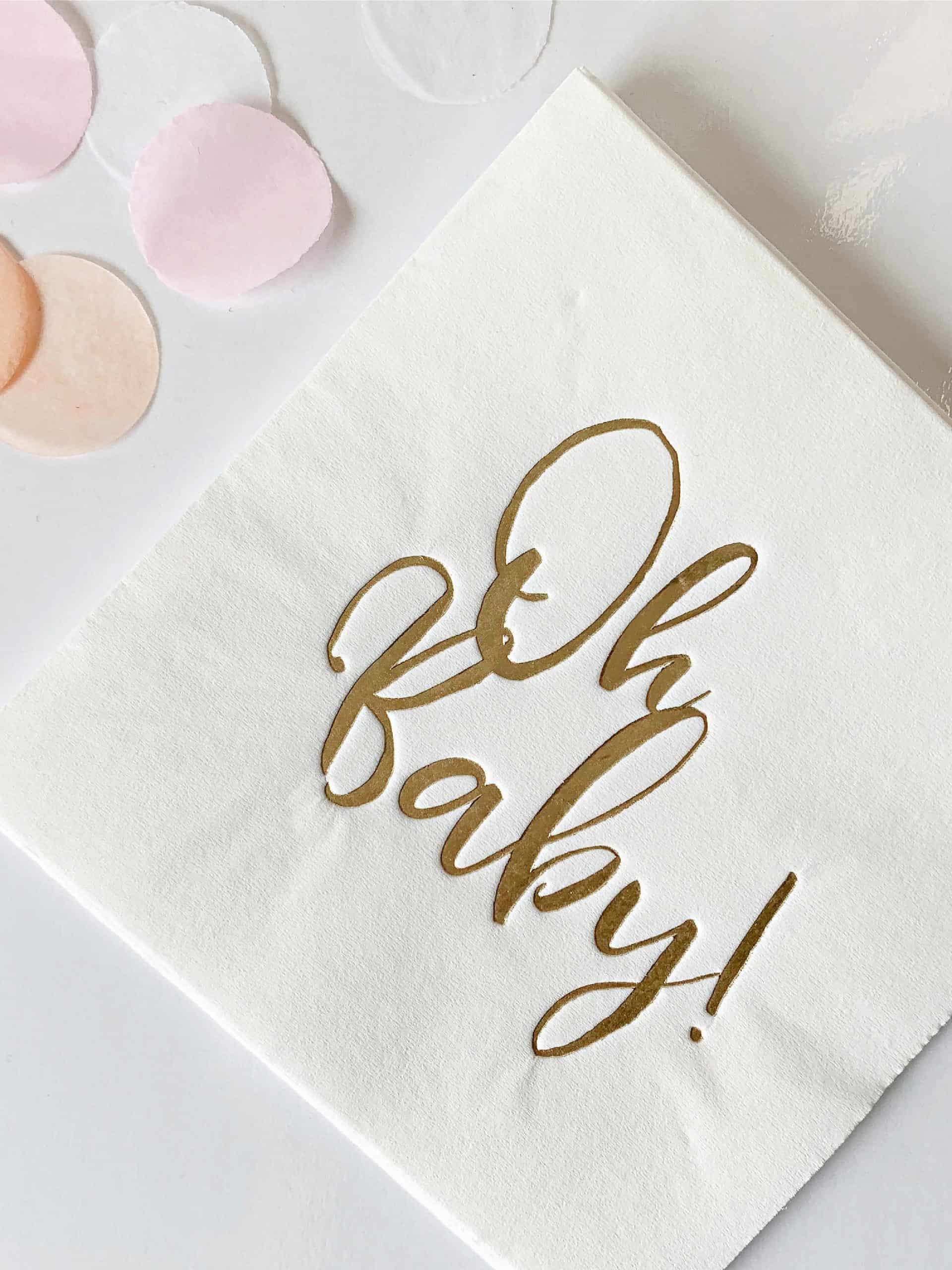 Oh Baby Cocktail Napkins in white with gold foil script Gorgeous 'Oh Baby' cocktail napkins with gold or silver foil script for a special baby shower celebration. #BabyShower #GoldFoil #CocktailNapkins