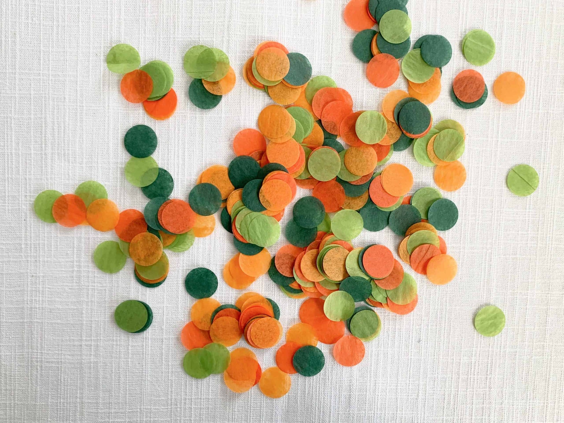 Celebrate the mom-to-be or the bride-to-be with our Little Cutie or She Found Her Main Squeeze Tissue Paper Confetti. In a fun citrus-inspired color palette of clementine, tangerine, forest green and lime, this confetti is the perfect way to add a pop of color to your party table.