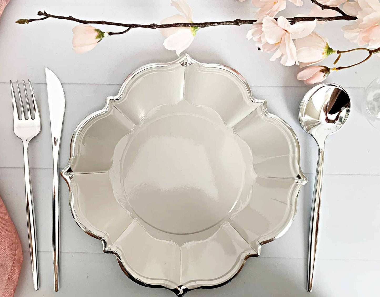 Grey scalloped luncheon-sized plates with silver foil edge details. Pretty plates for so many occasions - birthdays, New Year's eve, engagement parties, anniversary parties.