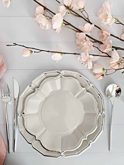 Add an elegant touch to your 25th anniversary or birthday celebration with our Grey Scalloped Dinner Plates with a Silver Foil Edge. These 10" plates are the perfect size for your guests to enjoy a delicious meal, while the elegant silver foil edge adds a touch of sophistication to your party decor.
