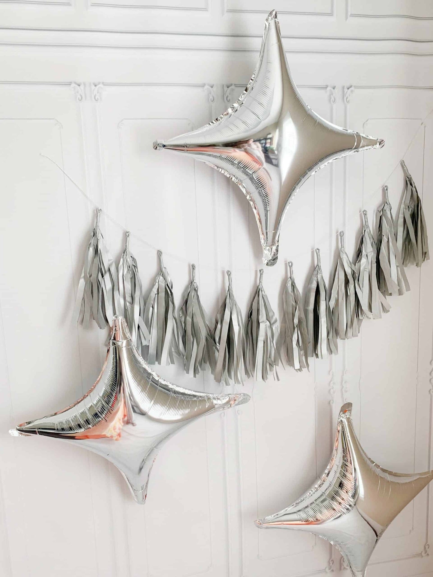 last disco balloons and silver tassel garland