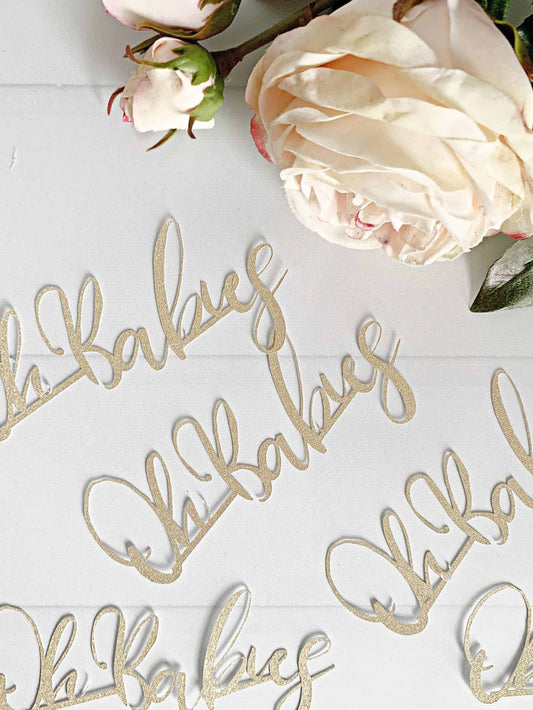 Oh Babies cutouts in gold sparkle paper. Perfect for an Oh Babies baby shower for twins and multiples!  The perfect table confetti for your baby shower or sip and see.  