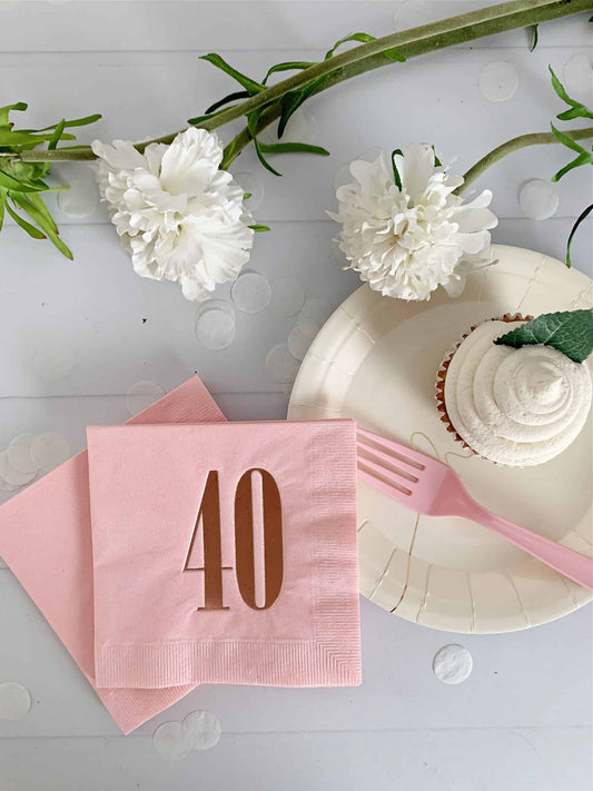 40th birthday party supplies - including these gorgeous rose gold foiled 40 napkins on blush cocktail napkins.