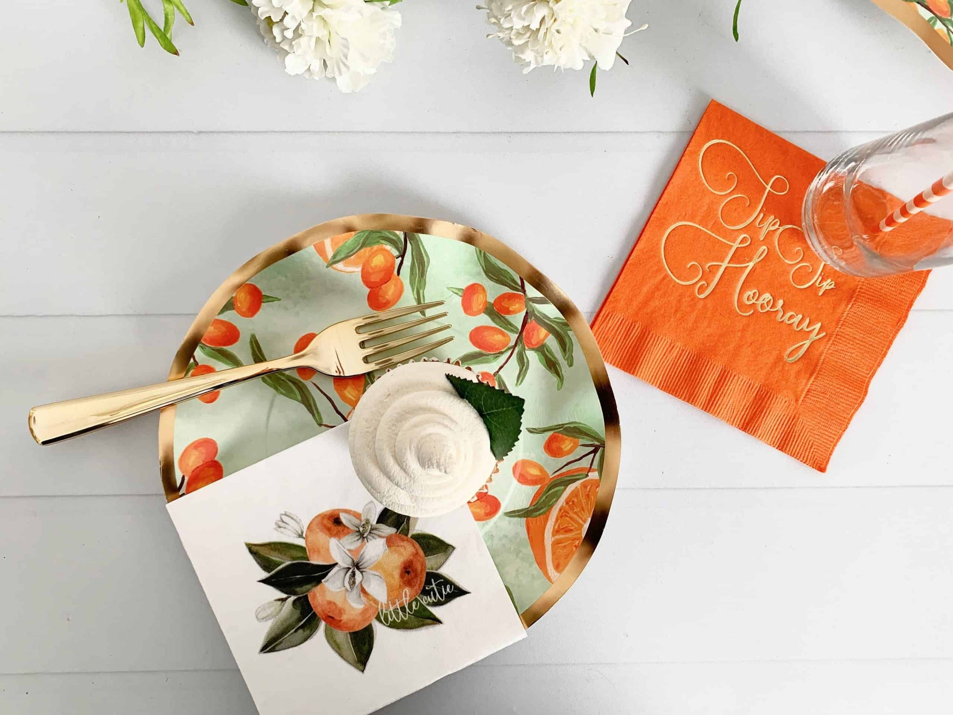 Add a touch of elegance to your special occasions with our Little Cutie Dessert Plates. These gorgeous paper plates feature a unique watercolor citrus fruit design, with a beautiful mint background and gold-rimmed details. The wavy edged Mimosa Clementine paper adds a charming touch to these plates, perfect for a She Found Her Main Squeeze bridal shower, Little Cutie baby shower, or citrus-themed wedding.