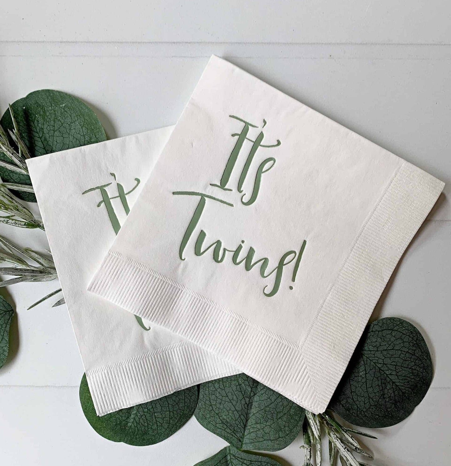 It's Twins! sage green foil on white cocktail/beverage-sized napkins - the perfect accent to your baby shower. These gorgeous gold foiled "It's Twins!" napkins are an EnFete original product. You won't find them anywhere else!