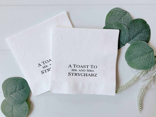 Introducing EnFete's beautiful collection of Wedding Cocktail Napkins - the perfect way to add a personalized touch to your wedding, bachelorette, bridal shower or other special event. Our extensive range of cocktail napkins are available in a variety of colors and foil options to match any color scheme or theme. Whether you're celebrating with champagne toasts, sharing slices of cake, or just enjoying a cocktail with friends, we've got you covered with our champagne toast napkins and wedding cake napkins. 