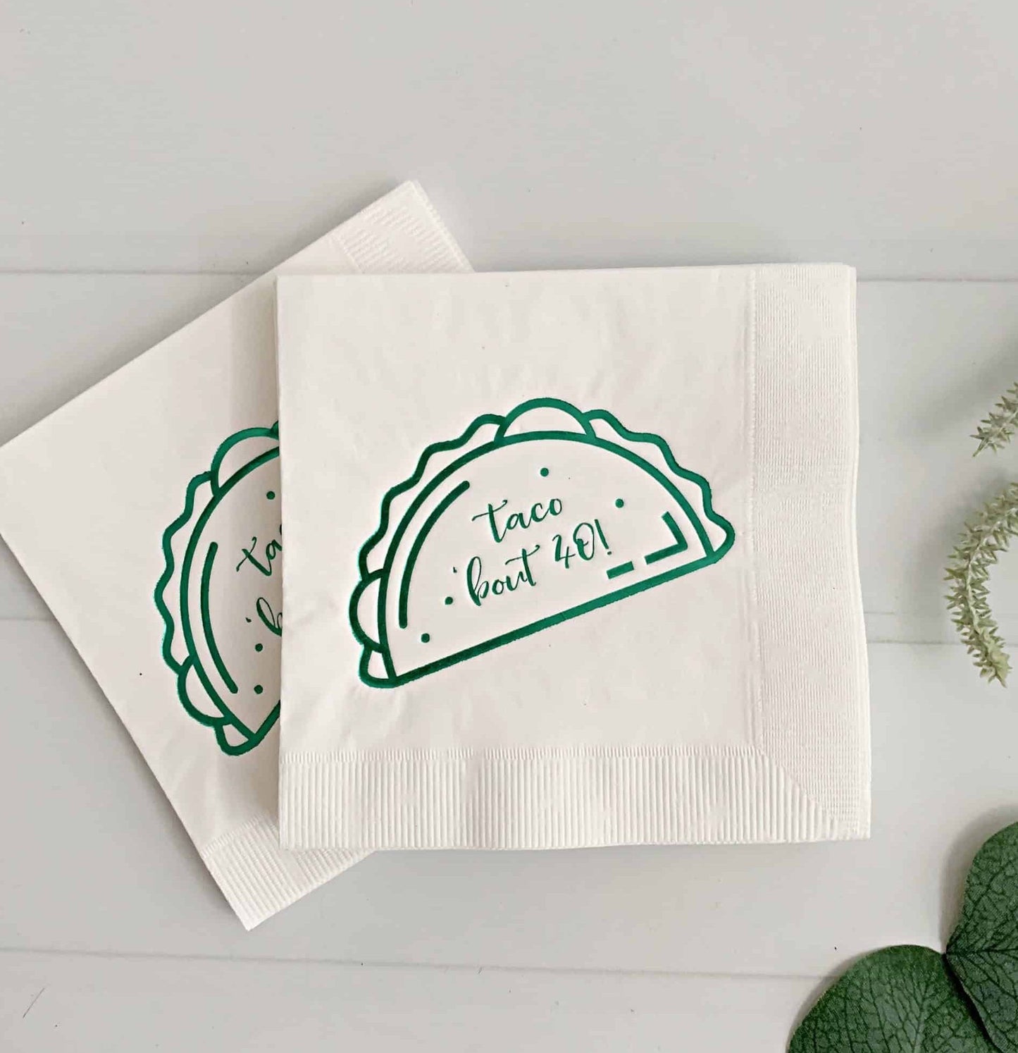 Add a touch of fun to your next fiesta or taco party with our "Taco Bout 40" cocktail napkins in green on white. These playful napkins feature a bright green design and humorous message, making them the perfect choice for a milestone birthday celebration or any fun-filled event. The high-quality material ensures they are both durable and absorbent, making them suitable for both indoor and outdoor events. So, get ready to taco 'bout a good time with our "Taco Bout 40" cocktail napkins.