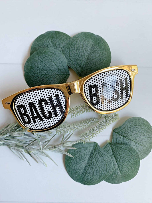 These gold bach bash sunglasses are the perfect way to show you're part of the "Bach Bash" - whether it's the bride's squad or the bride. Perfect for a bachelorette weekend or wedding afterparty.
