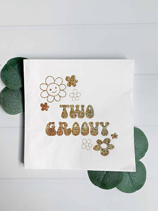 Add some sparkle to your celebration with our exclusive Two Groovy napkins featuring white with gold iridescent sparkle foil. #TwoGroovy #GoldSparkle #PartySupplies.