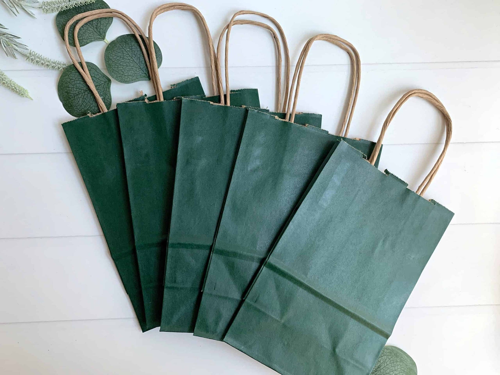 Hunter green gift and favor bags. Perfect for a Hole in One party or wedding welcome bag.