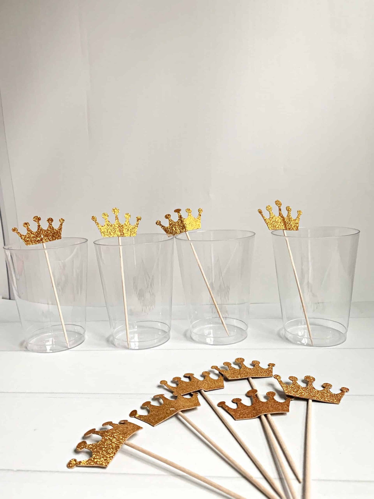 Add a touch of royalty to your charcuterie board or drinks with our gold crown charcuterie picks or drink skewers. This set of 10 elegant picks features a beautiful gold crown design, making them the perfect choice for a variety of events. Whether you're serving cheese, fruit, hors d'oeuvres, or cocktails, these skewers are sure to bring a touch of sophistication to your presentation. The sturdy construction ensures they are durable and long-lasting, making them suitable for both indoor and outdoor events. 
