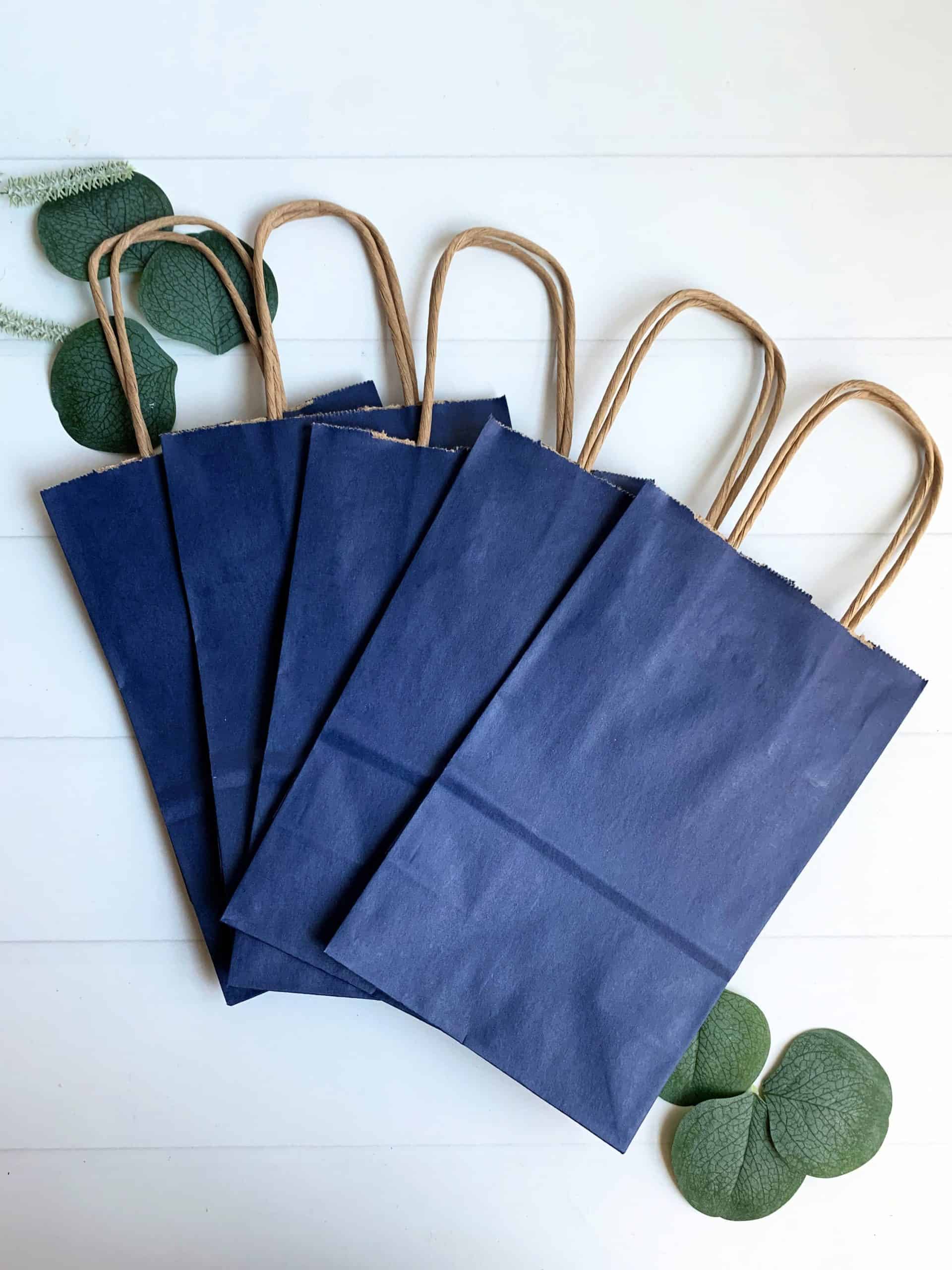 Welcome your guests in style with our navy blue favor and wedding welcome bags. These high-quality bags are the perfect way to show your appreciation and make a lasting impression. The elegant navy blue color and sturdy construction make these bags suitable for holding a variety of items, from wedding favors and gifts to welcome baskets and snacks. Whether you're planning a wedding, corporate event, or special celebration, these versatile bags are an essential addition to your event decor