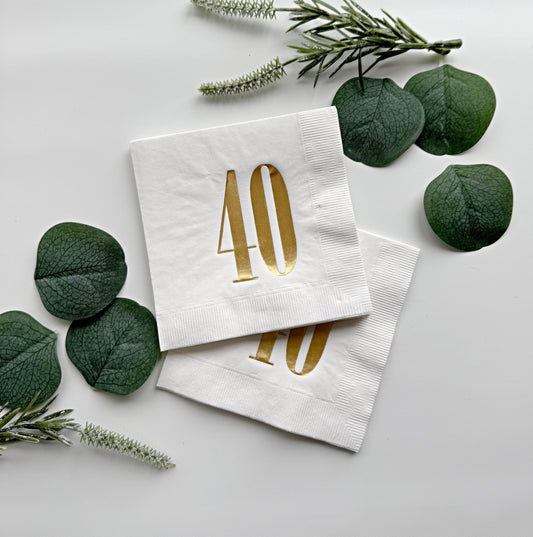 Milestone birthday napkins. The retro print design features a bold gold number 40, adding a touch of glamour to any 40th birthday party or anniversary celebration.