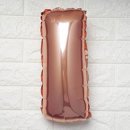 Rose gold letter 'L' balloon on a white textured background