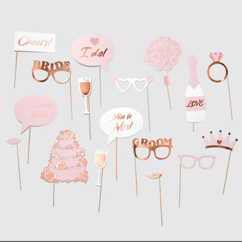 Set of 14 Rose Gold Wedding or Bridal Shower Photo Props, made of high-quality cardstock with rose gold foil details, mounted on wooden dowels for easy handling and photographing.
