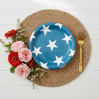 Angled view of blue star plates with red zinnias