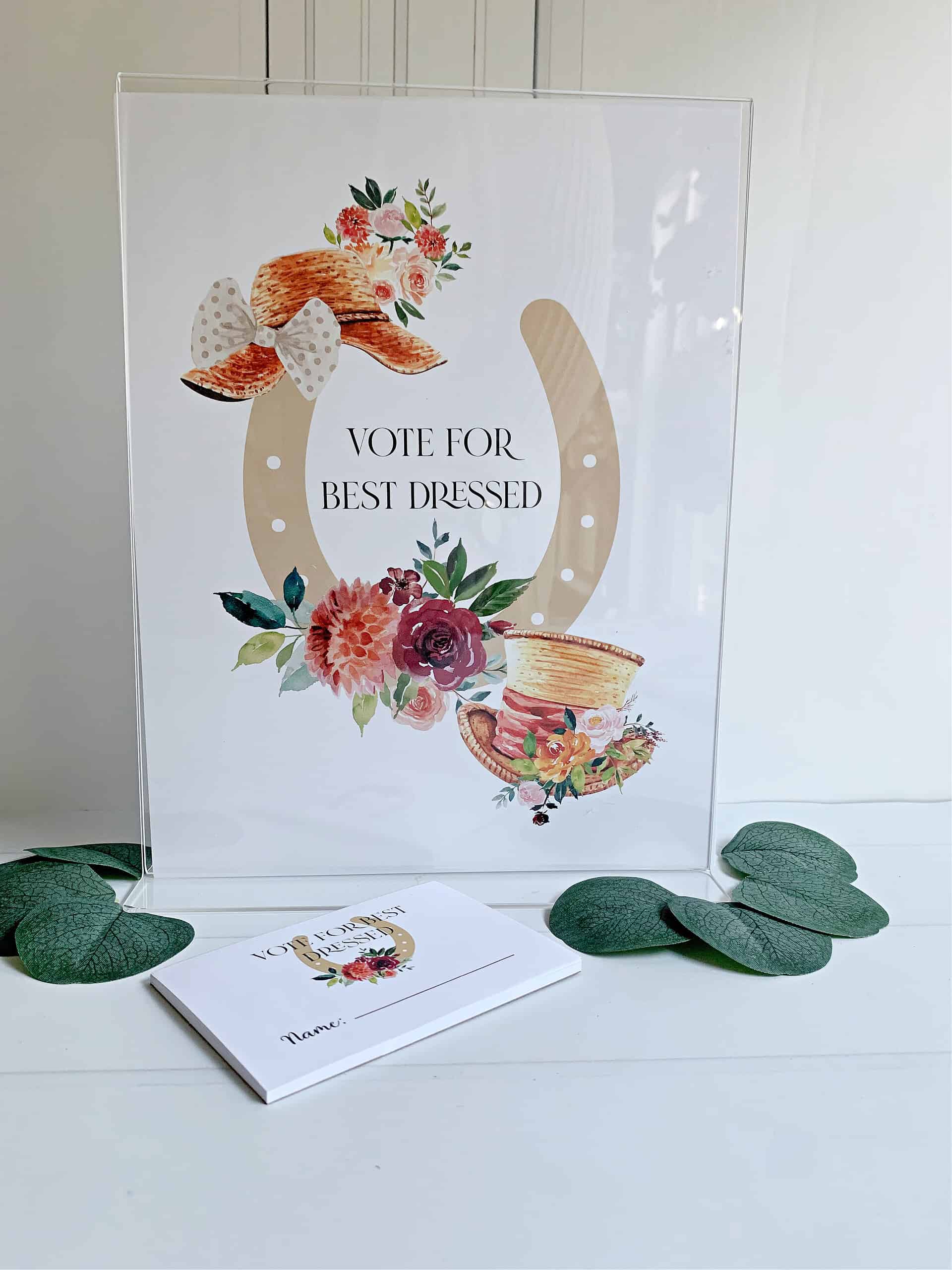 Create a fun and interactive experience at your Kentucky Derby party with EnFete's Derby "Vote for Best Dressed" Printed Sign. The sign, measuring 8.5 x 11 inches and printed on durable cardstock, adds a touch of elegance to your party decor while encouraging guests to participate in the festivities.