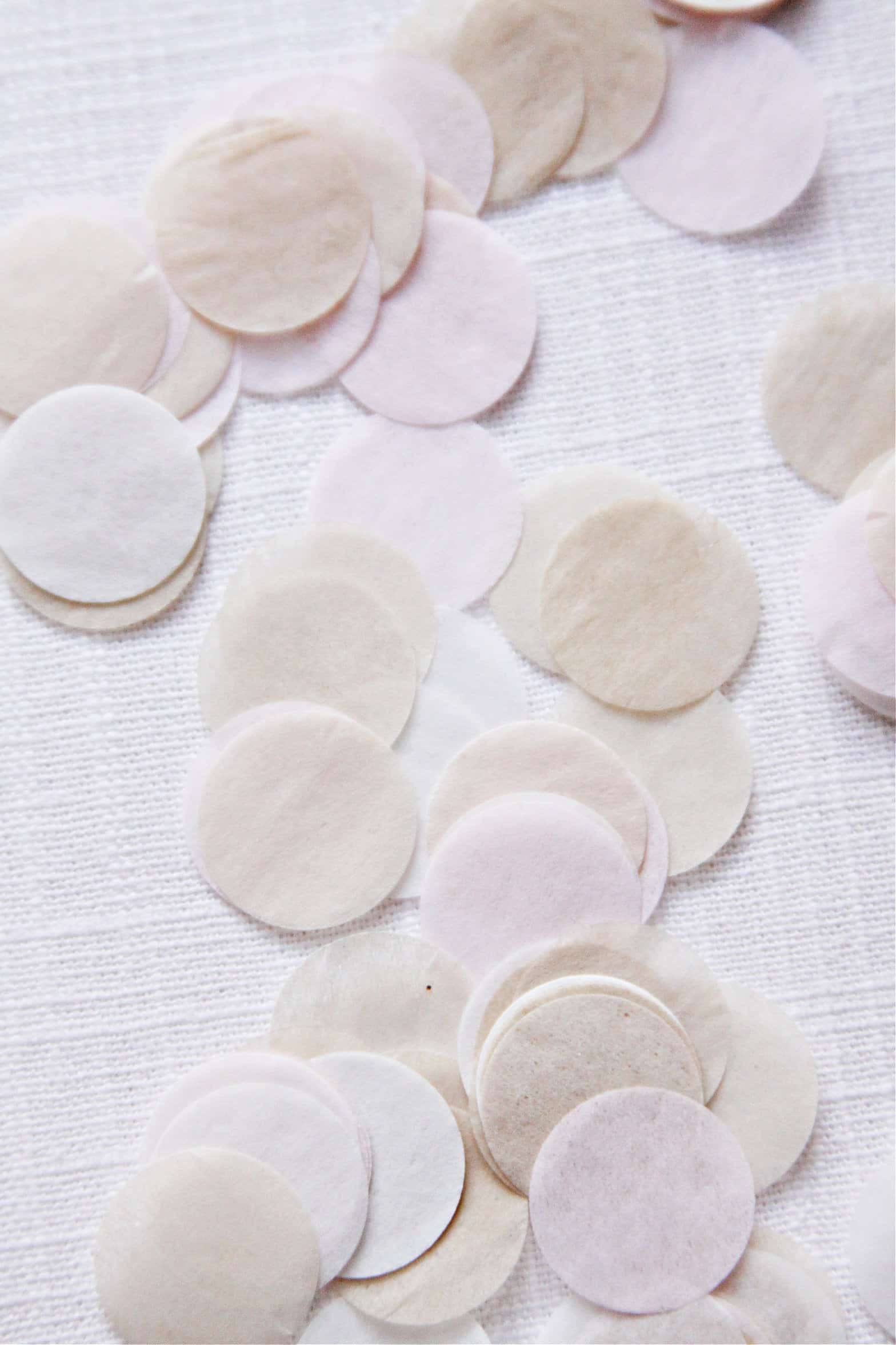 Blush and Cream confetti for a wedding baby shower or bridal shower. Made from round punches of tissue paper.