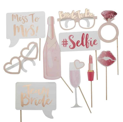 Rose gold and blush photo props for a bachelorette party