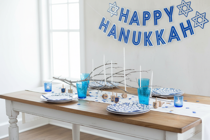 Bright airy Hanukkah table setup for collection photo