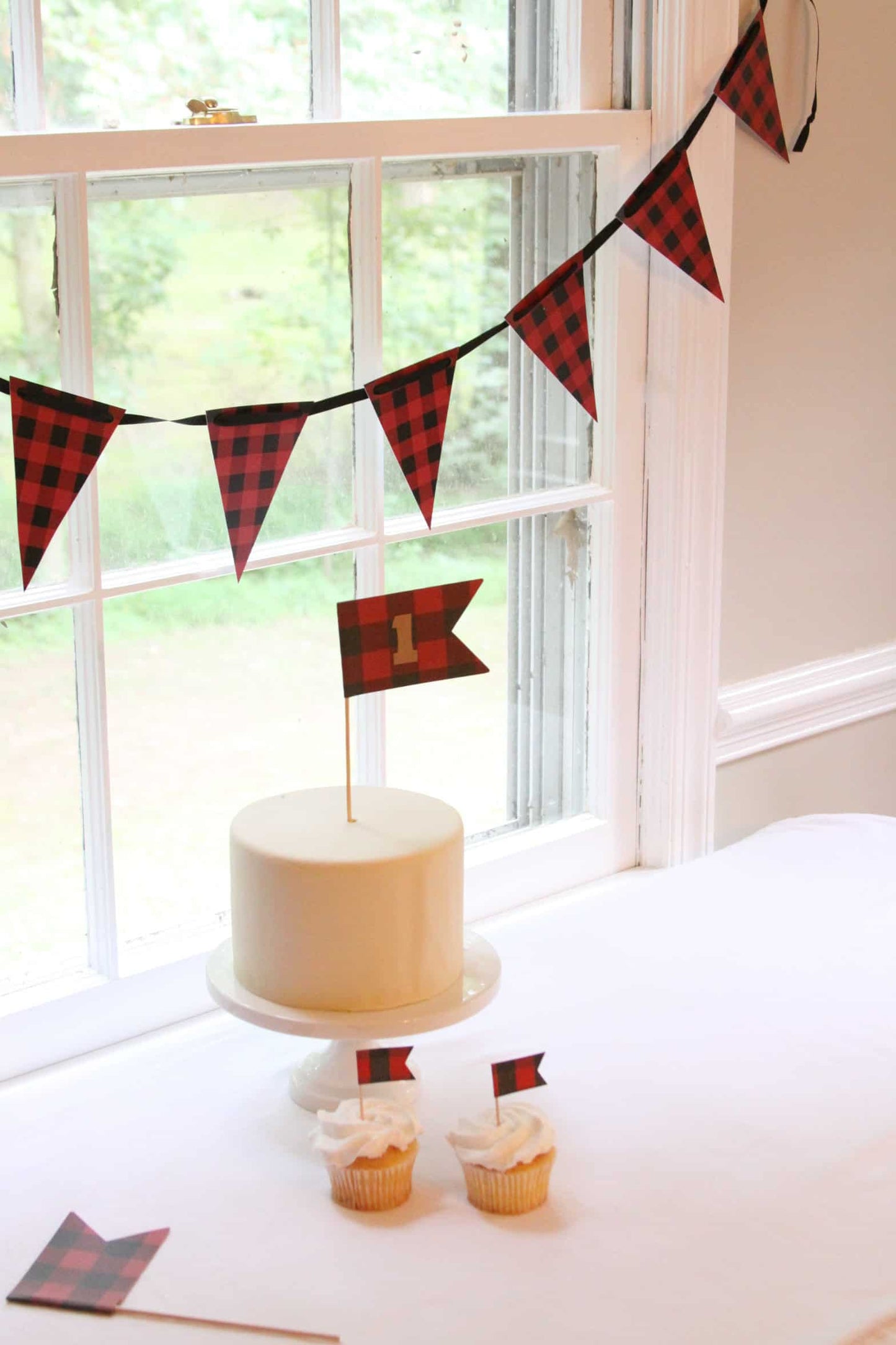 buffalo check birthday banner and cake for a lumberjack birthday